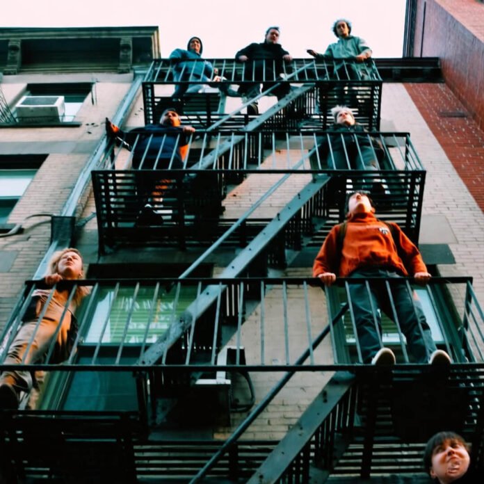 Fire escape climb chaos, NYC rooftop hunt. Fire escape climb chaos, NYC rooftop hunt.