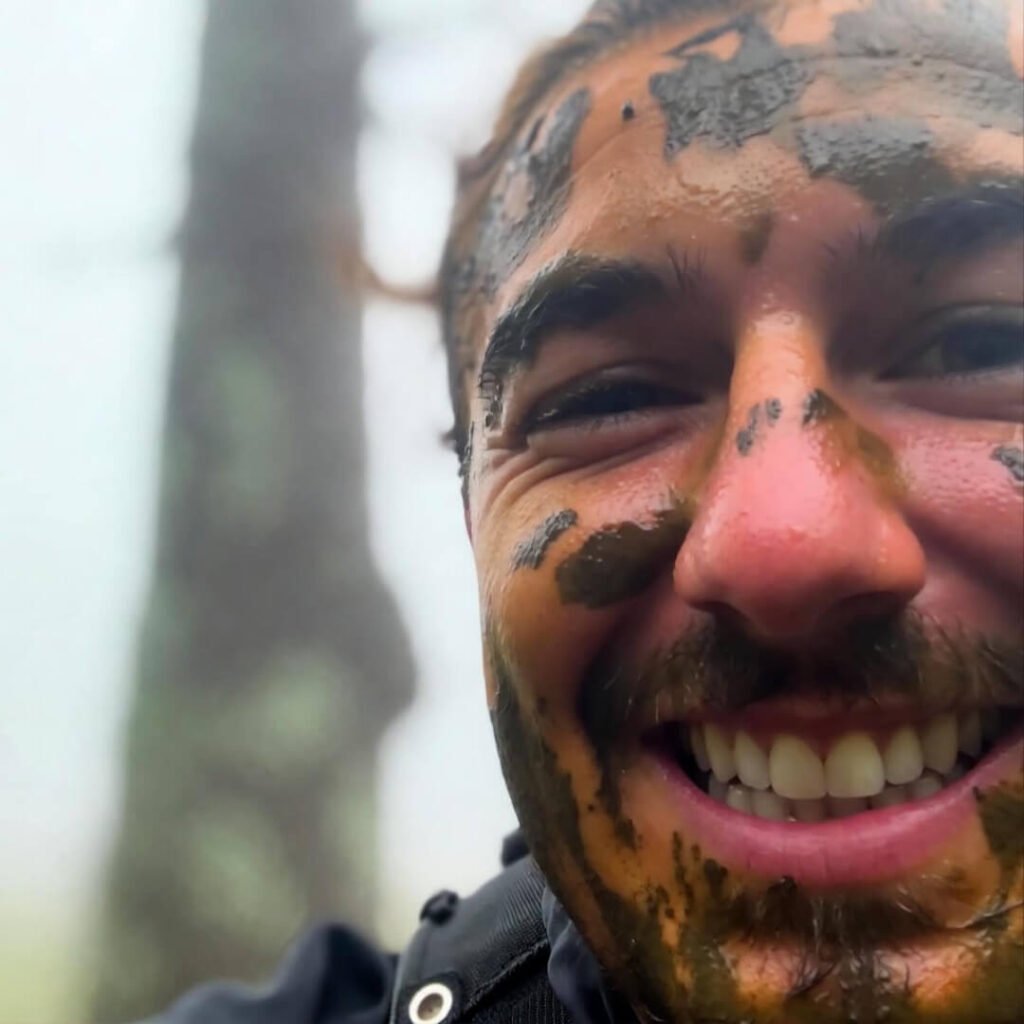 Muddy grin post-crash selfie.